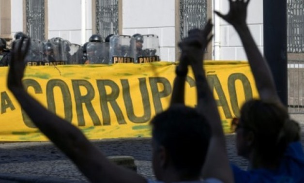 File- A leading prosecutor in Brazil's massive "Lava Jato" corruption probe says next year's elections will determine the fate of the fight to hold officials accountable, as seen in this protest Nov. 17 - AFP