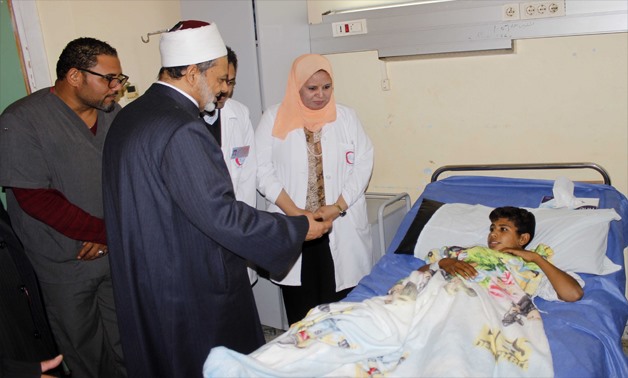 Egypt’s Grand Imam of Al Azhar Ahmed el Tayyeb, Mufti Shawki Allam and Minister of Religious Endowments (Awqaf) Mohamed Mokhtar Gomaa visiting al-Rawdah’s terrorist attack victims at the hospital in Ismailia governorate, Friday December 1, 2017 - Press Ph