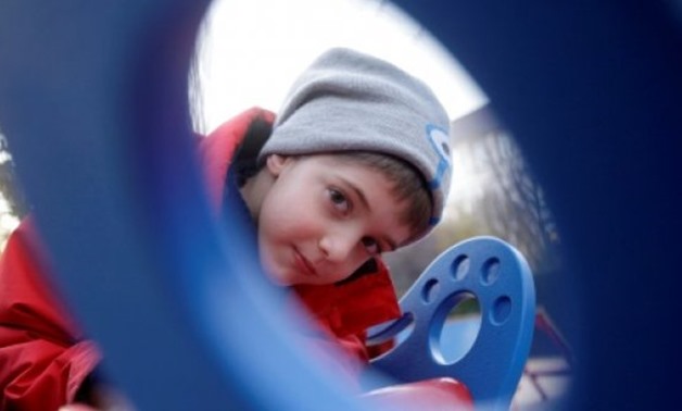 © AFP / by Peter MURPHY | Seven-year-old Aron, who was born with epilepsy, can now join the fun on specially built equipment in some 30 Budapest playgrounds