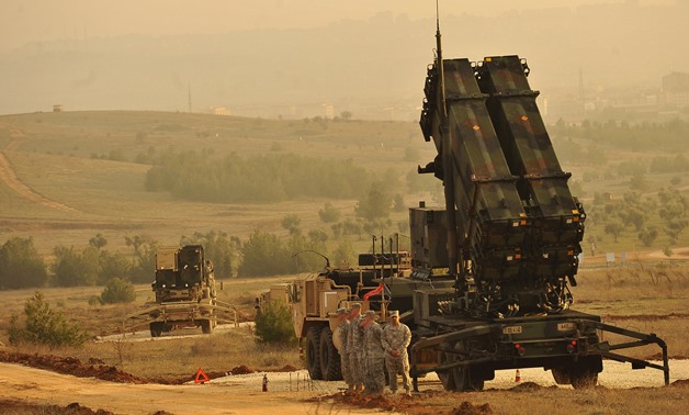 U.S. Service members stands by a Patriot missile battery in Gaziantep, Turkey, Feb. 4, 2013, during a visit from U.S. Deputy Secretary of Defense Ashton B. Carter, not shown. U.S. and NATO Patriot missile batteries and personnel deployed to Turkey in supp