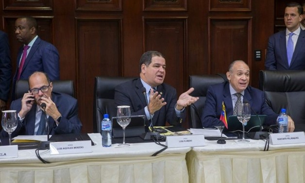 Venezuela's opposition representatives (L to R) Luis Aquiles Moreno, Luis Florido and Gustavo Velazquez attend a meeting with representatives of the Venezuelan government on December 2, 2017, aiming to resolve their country's crisis
