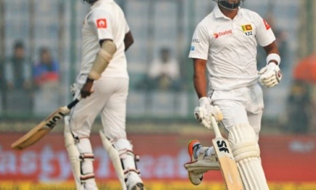 © AFP | Sri Lankan batsmen Angelo Mathews (L) and captain Dinesh Chandimal continued their side's first innings against Indiaat a haze-shrouded Feroz Shah Kotla stadium