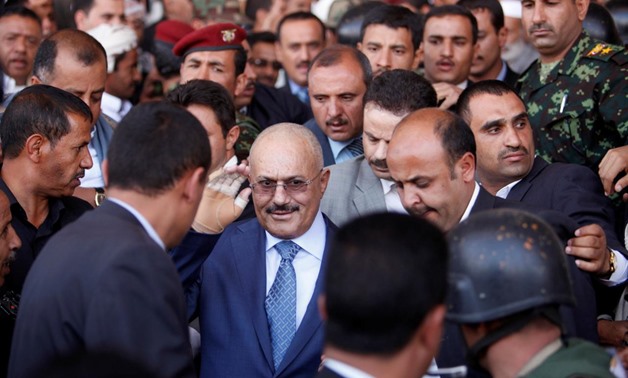 FILE PHOTO: Yemen's former President Ali Abdullah Saleh gestures as he arrives to a rally in Sanaa February 27, 2013. REUTERS/Khaled Abdullah