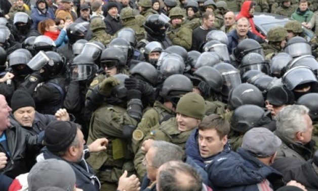 © AFP / by Oleksandr SAVOCHENKO | Supporters freed Saakashvili from a police van
