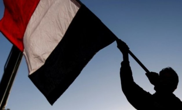 © AFP | A Yemeni waves a national flag during a rally celebrating the death of Yemeni ex-president Ali Abdullah Saleh a day after he was killed, in the capital Sanaa on December 5, 2017
