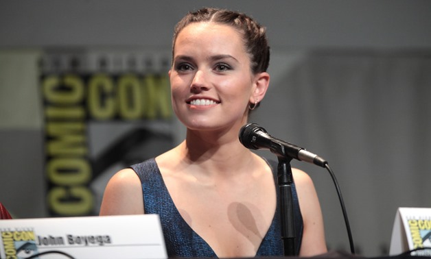 Photograph of Daisy Ridley at the 2015 San Diego Comic Con, July 10, 2015 – Flickr/Gage Skidmore