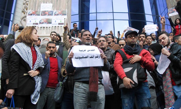 Journalists and people protest against U.S. President Donald Trump's decision of recognizing Jerusalem as Israeli Capital. The protest staged outside the Journalists' Syndicate downtown Cairo on Thursday - Egypt Today / Mahmoud Fakhry