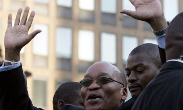 © AFP/File | South Africa's Jacob Zuma celebrates his acquittal on charges of rape outside Johannesburg's High Court in May 2006
