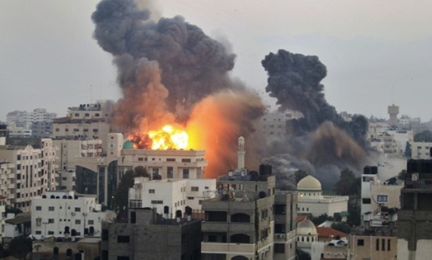 Smoke and explosion are seen after Israeli air strikes in Gaza City November 19, 2012. PHOTO: REUTERS