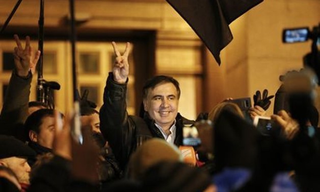 Ukrainian opposition figure and Georgian former President Mikheil Saakashvili (C) reacts after he was released from detention in Kiev, Ukraine December 11, 2017. REUTERS/Gleb Garanich
 