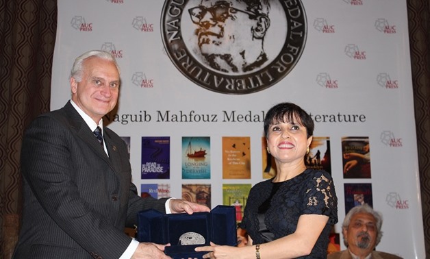 Huzama Habayeb receiving the Mahfouz Medal from AUC President Francis J. Ricciardone Jr, December 11, 2017 - AUCPress.com