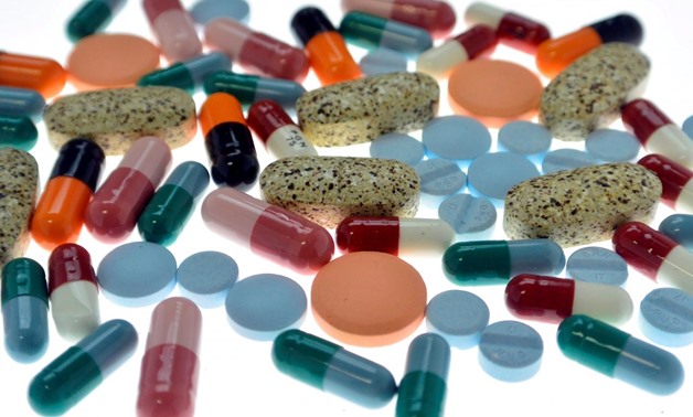 FILE PHOTO: Pharmaceutical tablets and capsules are arranged on a table in a photo illustration shot September 18, 2013. REUTERS/Srdjan Zivulovic/Illustration/File Photo