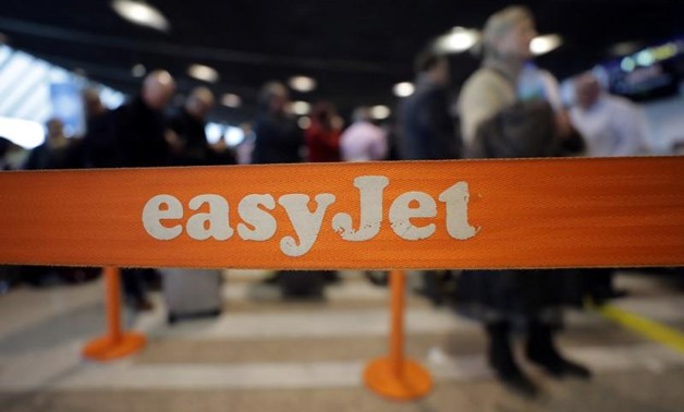 FILE PHOTO: EasyJet passengers line up at Nice Cote d'Azur airport as most of the flights are cancelled due to a storm in Nice, France, December 11, 2017. REUTERS/Eric Gaillard