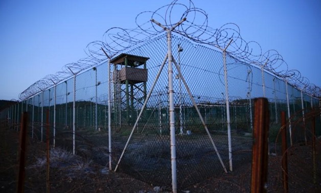  Chain link fence and concertina wire surrounds a deserted guard tower within Joint Task Force Guantanamo's Camp Delta at the U.S. Naval Base in Guantanamo Bay, Cuba March 21, 2016. REUTERS