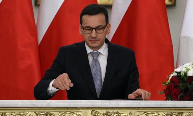 Newly appointed Polish Prime Minister Mateusz Morawiecki reacts after receiving his nomination from President Andrzej Duda (not pictured) during a government swearing-in ceremony in Warsaw, Poland, December 11, 2017. Agencja Gazeta/Slawomir Kaminski via R