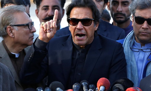 Imran Khan, chairman of the Pakistan Tehreek-e-Insaf (PTI) political party, gestures as he addresses members of the media, after Pakistan's Supreme Court dismissed a petition to disqualify him from parliament for not declaring assets, outside Jinnah Inter