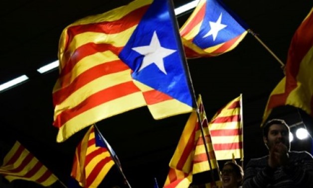 © AFP / by Daniel Bosque with Michaela Cancela-Kieffer in Madrid | Pro-independence supporters wave Catalan flags during a campaign event in Barcelona ahead of pivotal regional elections

