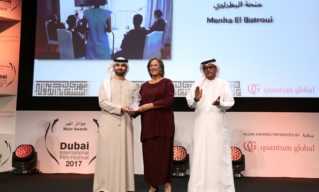 Menha al-Batraoui receiving the Muhr Feature award for best actress during the 14th Dubai International Film Festival