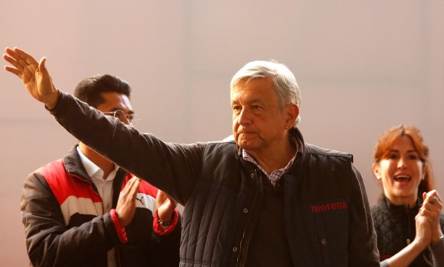 Mexican presidential candidate Andres Manuel Lopez Obrador of the National Regeneration Movement (MORENA) gestures to supporters during a pre-campaign rally in Mexico City, Mexico December 17, 2017. REUTERS/Ginnette Riquelme