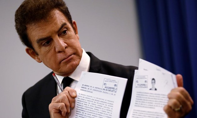 Honduran opposition candidate Salvador Nasralla displays documents filed with Honduran election officials during a news conference in Washington, U.S., December 19, 2017. REUTERS/Joshua Roberts