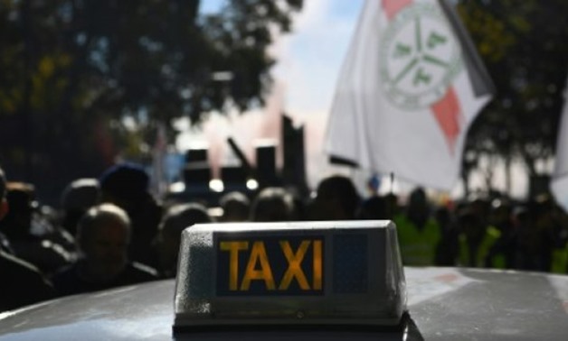 © AFP/File | Spanish taxi drivers have staged protests, complaining that Uber flouts local regulations