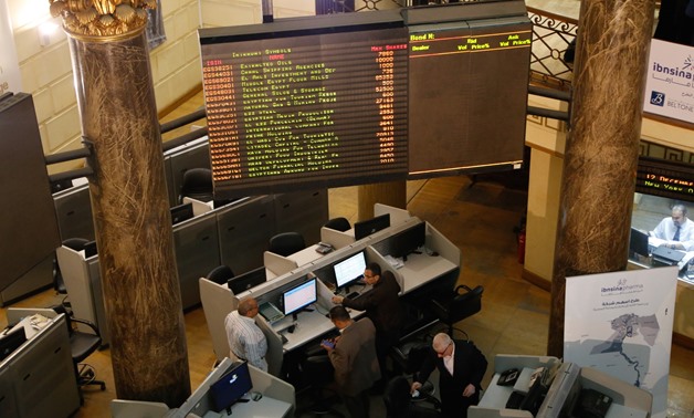 FILE - Employees in the EGX following performance of the trading session