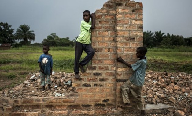 © Joh, Wessels, AFP | Children play near the ruins of a house in October 2017 in Kasaï, DR Congo
