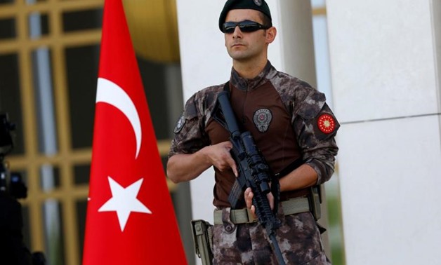 A Turkish special forces police officer guards the entrance of the Presidential Palace in Ankara, Turkey, August 5, 2016. REUTERS/Umit Bektas