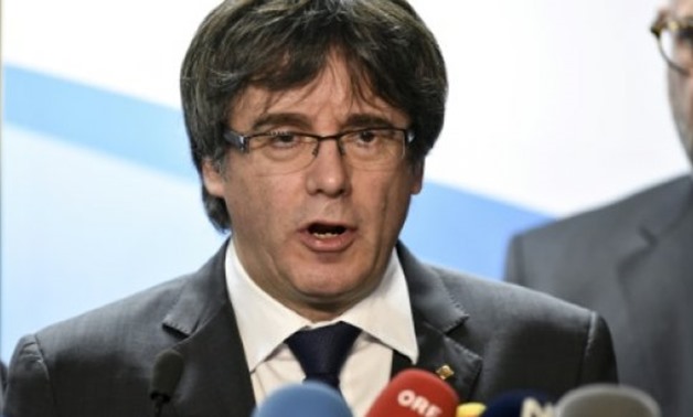 © AFP | Axed Catalan president Carles Puigdemont gives a press conference in Brussels on December 22, 2017