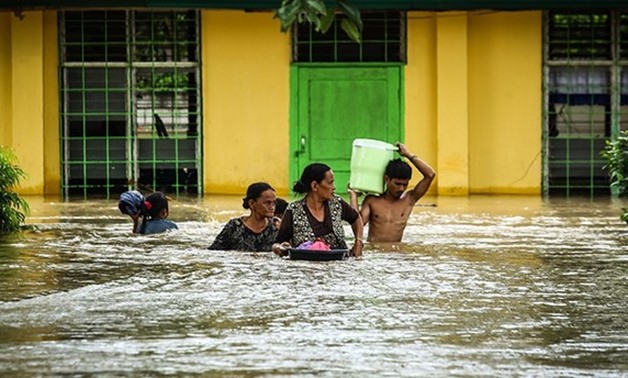 Residents evacuate after Tropical Storm Tembin struck in Kabacan, the southern island of Mindanao, Philippines - AFP
