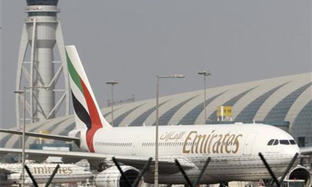 Emirates airplanes are seen at the airport in Dubai October 30, 2010. REUTERS/Ahmed Jadallah