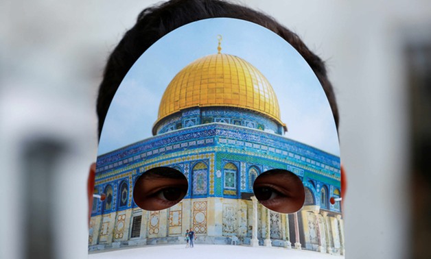 A man wearing a mask with an image of the Dome of the Rock takes part in a pro-Palestinian demonstration in Istanbul (Reuters)