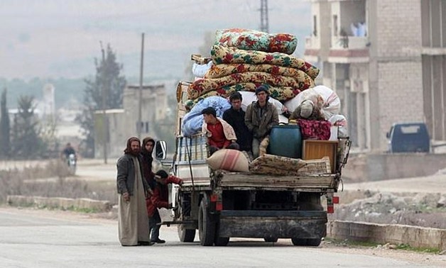 Syrian flee heavy fighting between government forces and mainly jihadist rebels, heading for the northwestern city of Idlib away from the front line on December 29, 2017 - AFP 

