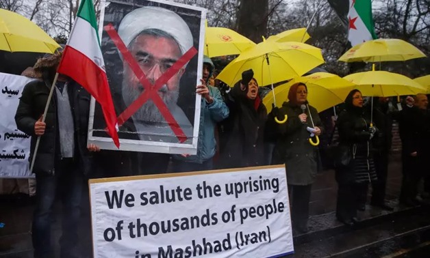 Opponents of Iranian President Hassan Rouhani hold a protest outside the Iranian Embassy in west London – Reuters/Eddie Keogh 