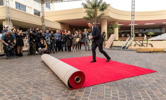 Seth Meyers, host of the 75th Annual Golden Globes Awards, poses for photos on the red carpet