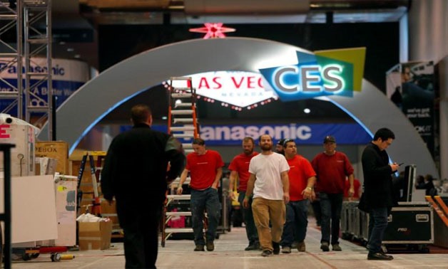 Workers walk through Las Vegas Convention Center lobby as they prepare for the 2018 CES in Las Vegas, Nevada, U.S. January 5, 2018 - REUTERS/Steve Marcus