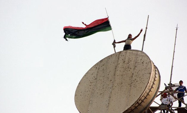 Libyan flag above the communications tower in Al Bayda, 2011 - Creative Commons via Wikimedia commons