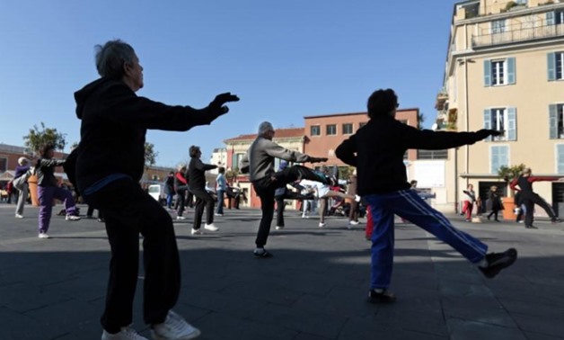 FILE PHOTO - A group of retired people take part in a Tai Chi class session in Nice February 19, 2013. REUTERS/Eric Gaillard