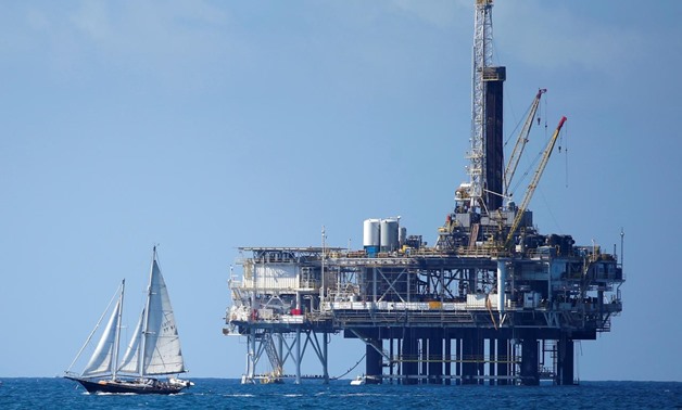 FILE PHOTO: An offshore oil platform is seen in Huntington Beach, California September 28, 2014. REUTERS/Lucy Nicholso