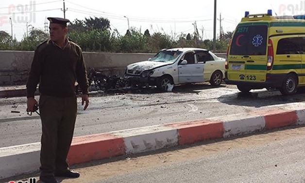 Policeman observing the scene of the explosion - Youm7
