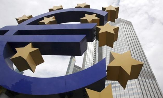 The Euro sign sculpture stands in front of the headquarters of the former European Central Bank