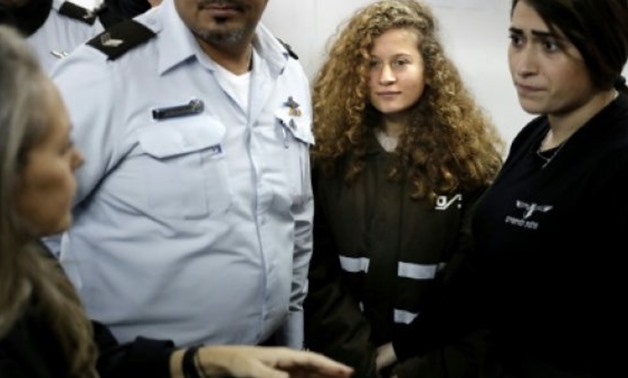 AFP | An Israeli military judge has ordered 16-year-old Palestinian Ahed Tamimi, seen here at a previous hearing on January 15, 2018, held in custody until trial