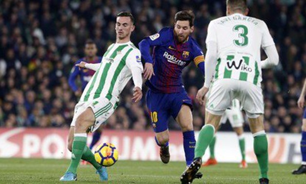 Lionel Messi manipulating Real Betis' defenders - Press image courtesy of Barcelona's official website
