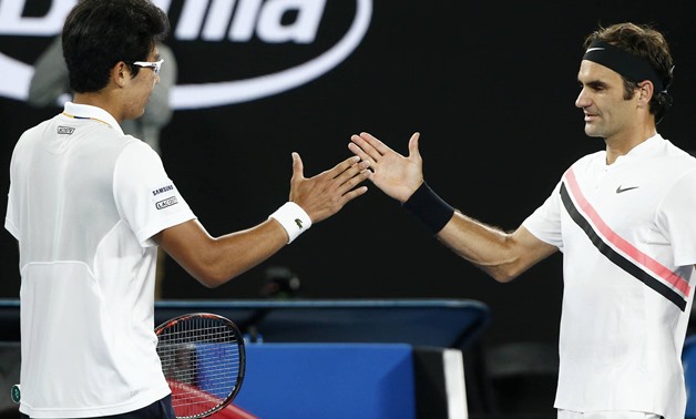 Tennis - Australian Open - Men's singles semifinals - Rod Laver Arena, Melbourne, Australia, January 26, 2018. Chung Hyeon of South Korea shakes hands with Roger Federer of Switzerland after Chung retired from their match. REUTERS/Thomas Peter