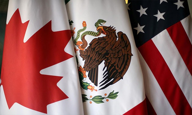 Flags are pictured during the fifth round of NAFTA talks involving the United States, Mexico and Canada, in Mexico City, Mexico, November 19, 2017 -
 REUTERS/Edgard Garrido/File Photo