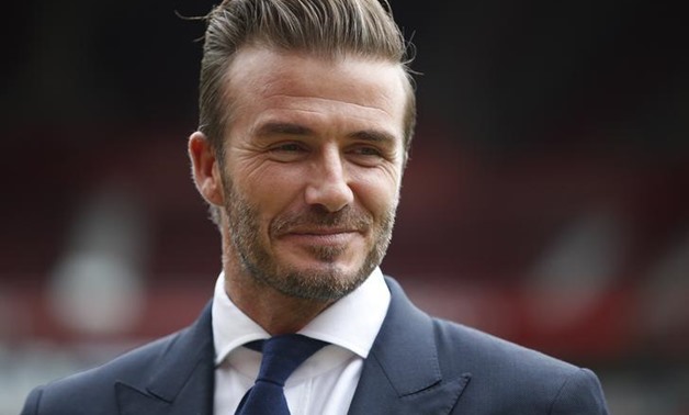 David Beckham poses for photographers at Old Trafford, ahead of his upcoming charity soccer match against a Rest of the World team led by Zinedine Zidane at Old Trafford to raise awareness and funds for UNICEF, in Manchester, Britain, October 6, 2015. REU