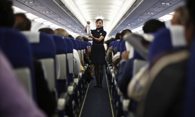 An Indigo Airlines' cabin crew member goes over safety guidelines during a flight from New Delhi to Srinagar city November 21, 2014. REUTERS/Adnan Abidi