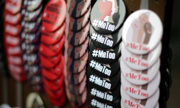 A vendor sells #MeToo badges at a protest march for survivors of sexual assault and their supporters in Hollywood, Los Angeles, California U.S. November 12, 2017. REUTERS/Lucy Nicholson/File Photo