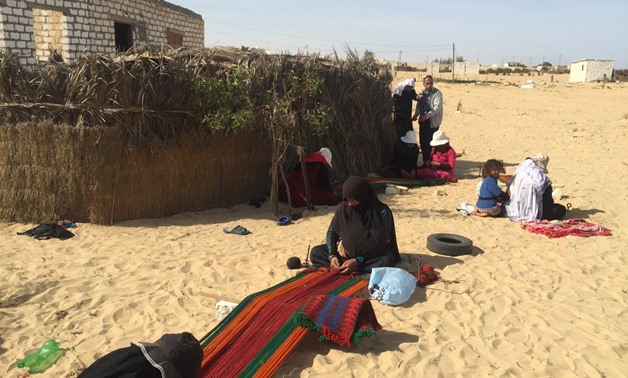 FILE: Bedouin women  weaver weaving a Kilim wool rug