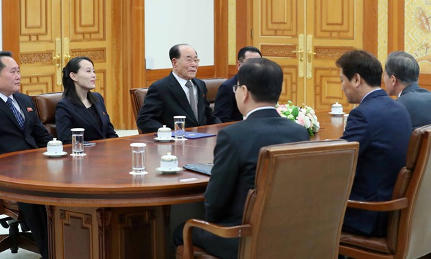 South Korean President Moon Jae-in talks with President of the Presidium of the Supreme People's Assembly of North Korea Kim Young Nam and Kim Yo Jong, the sister of North Korea's leader Kim Jong Un, during their meeting at the Presidential Blue House in 